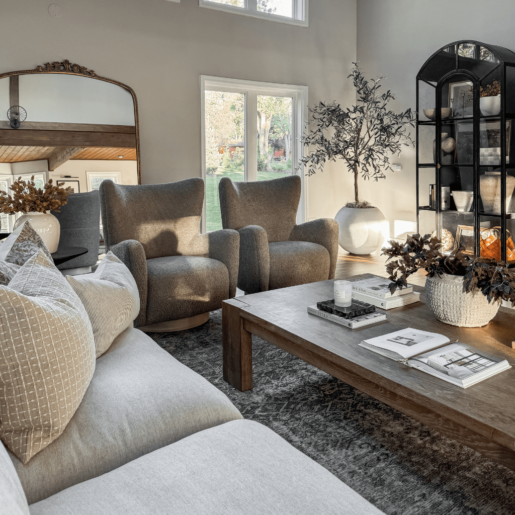 Living room view with the Carly Pillow combination on a gray sofa