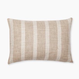 A rectangular beige pillow with a textured fabric featuring wide, light beige vertical stripes. The pillow has a simple, modern design and appears to be comfortable and suitable for decorative or functional use.