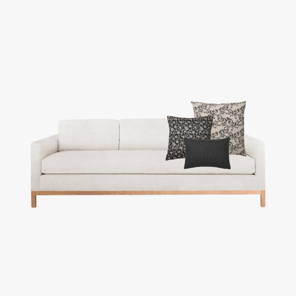 Ezra pillow combo with Magnolia, Felix, and Onyx Lumbar on a cream sofa