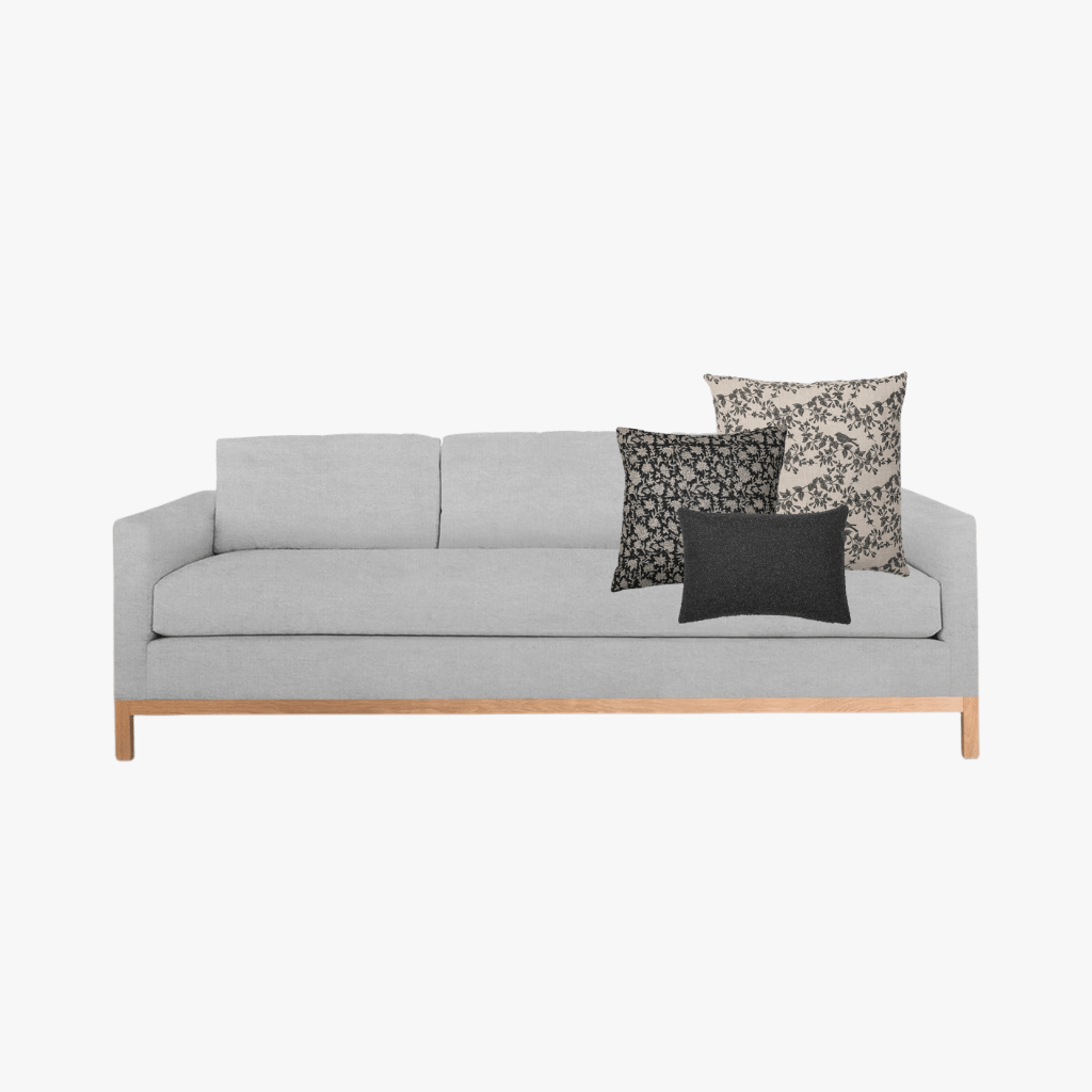 Ezra pillow combo with Magnolia, Felix, and Onyx Lumbar on a light gray sofa