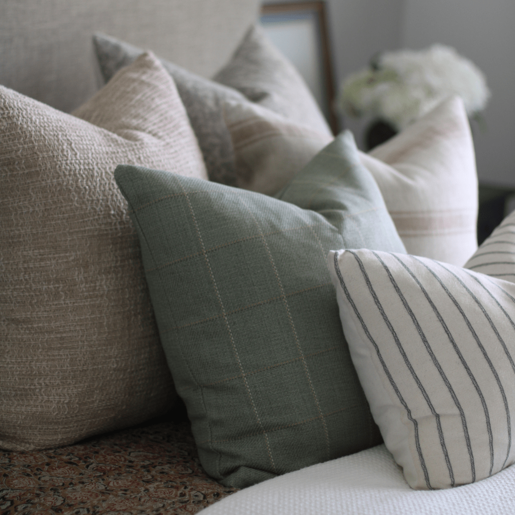 Closeup of 3 Colin + Finn pillows, the Weston, Allister, and Winston Lumbar