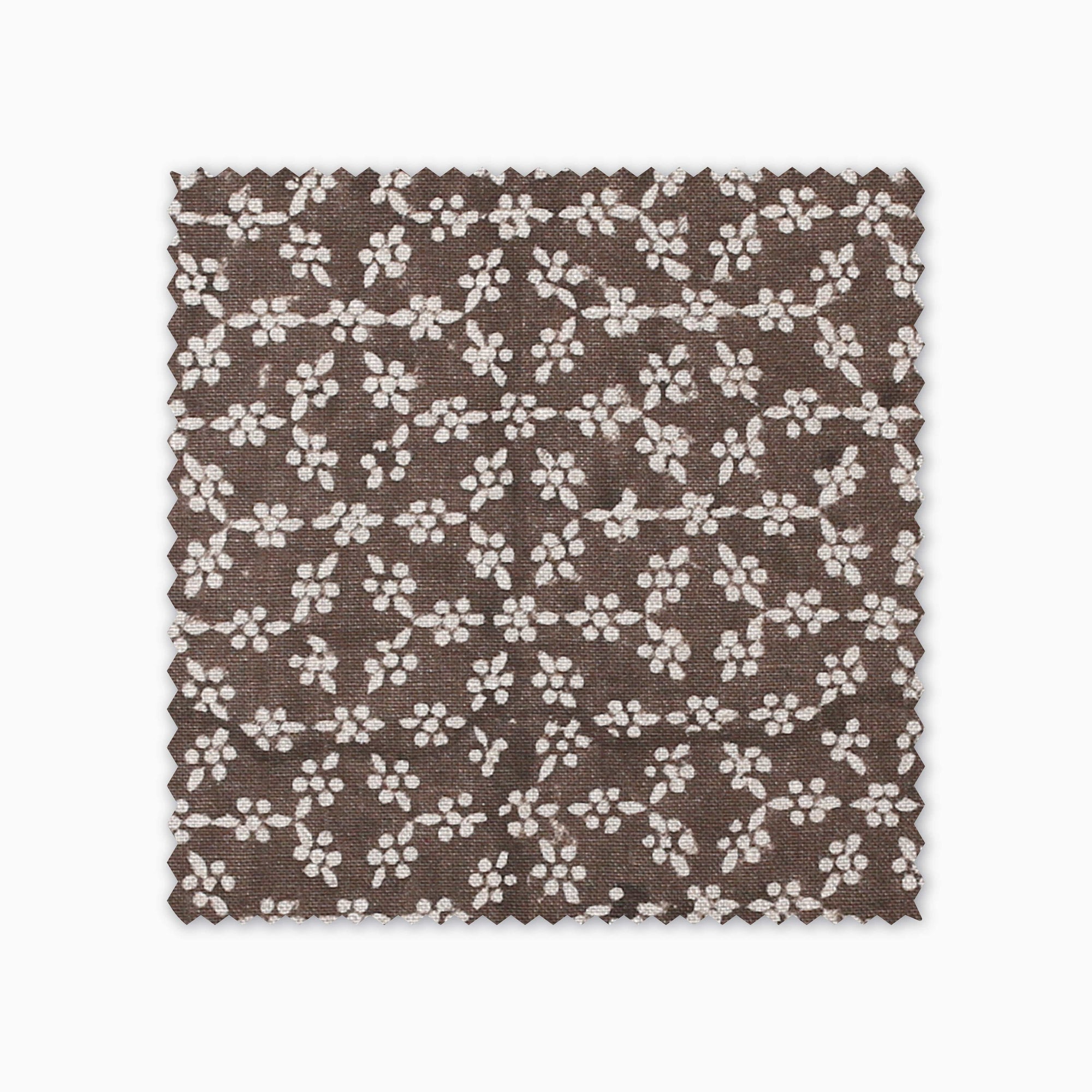 Neville Mocha fabric swatch from Colin and Finn. Cream flowers on a brown background