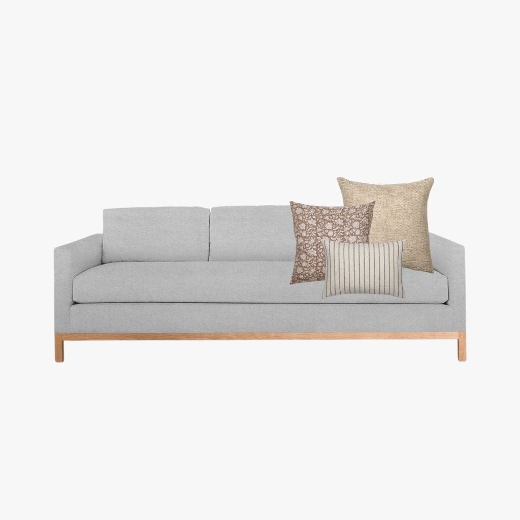 Mockup of Spencer Combo from Colin and Finn on light gray three-seat sofa